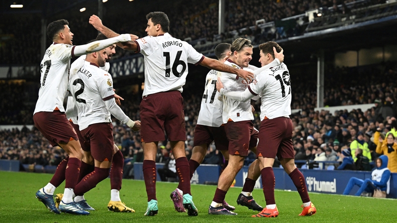Julian Alvarez (R) celebrates with his team-mates after scoring Manchester City's second goal