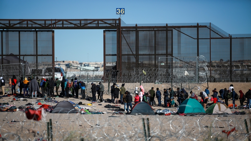 People camp as they wait to cross the border between Mexico and the United States in Ciudad Juarez, Mexico