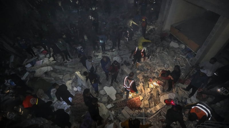 People inspect damage to their homes caused by Israeli air strikes
