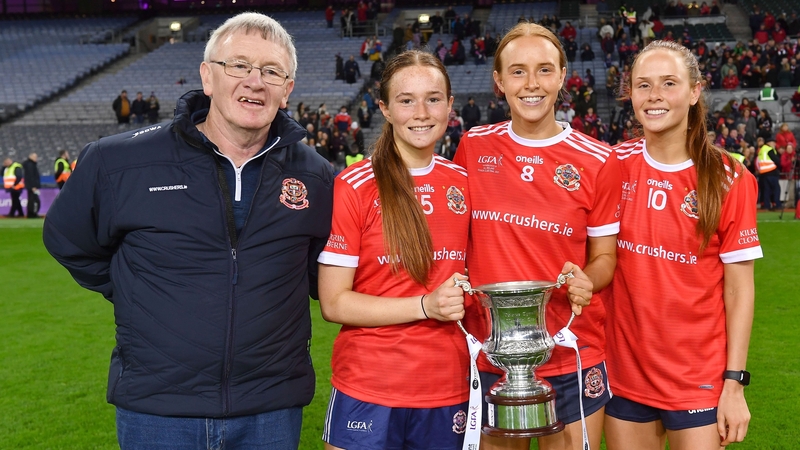 Kilkerrin-Clonberne players, from right, Olivia Divilly, Siobhán Divilly and Niamh Divilly with their dad Michael and the Dolores Tyrrell Memorial Cup