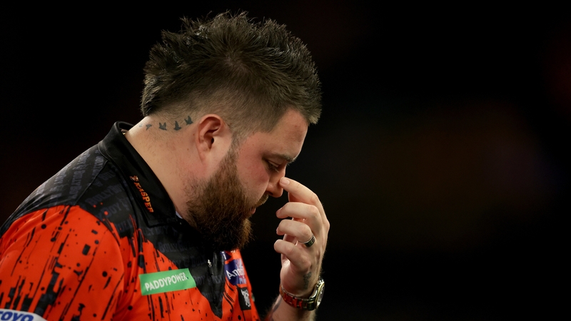 Michael Smith looks dejected during the defeat to Chris Dobey