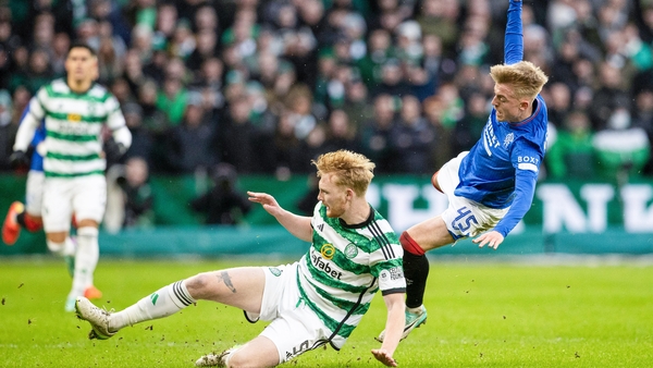 Celtic's Liam Scales tackles Rangers' Ross McCausland