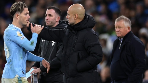 Pep Guardiola embraces Grealish after he is taken off