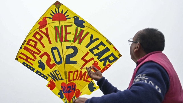 A man flies a decorated 2024 kite in Amritsar in India