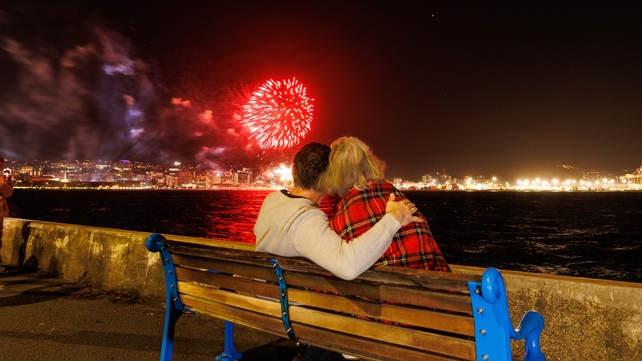 People gather around Whairepo Lagoon in New Zealand for music and fireworks