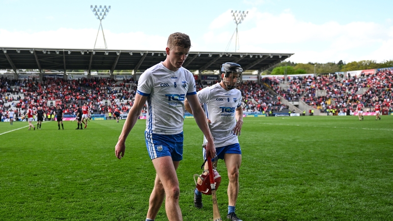 Darragh Lyons and Jamie Barron depart the field after Waterford's Munster SHC loss to Cork