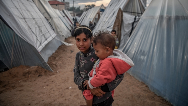 Palestinian children living in a tent city where they took shelter to protect themselves from Israeli attacks in Rafah