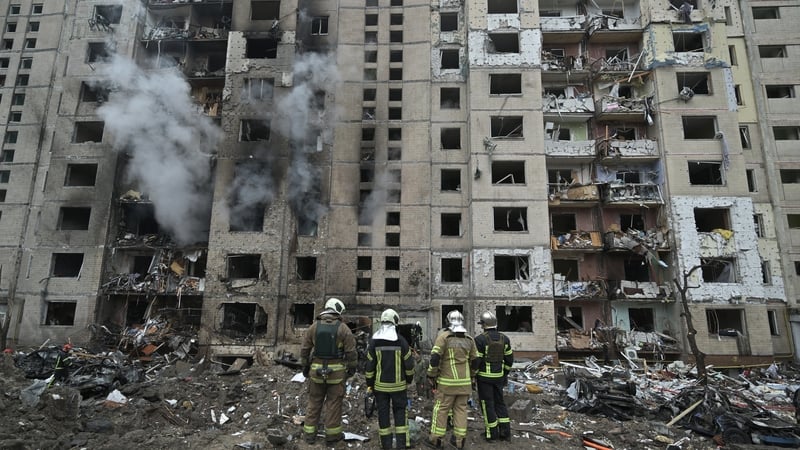 Firefighters at residential building destroyed by a Russian missile attack in central Kyiv earlier this month. Photo: Getty Images