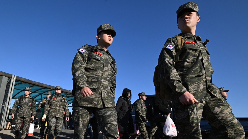 South Korean marines disembark from a passenger ferry at Yeonpyeong island today
