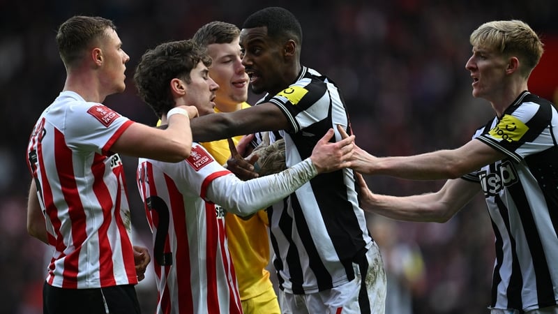 Alexander Isak, who scored Newcastle's second goal, clashes with Sunderland's Daniel Ballard (L) who netted an earlier own goal