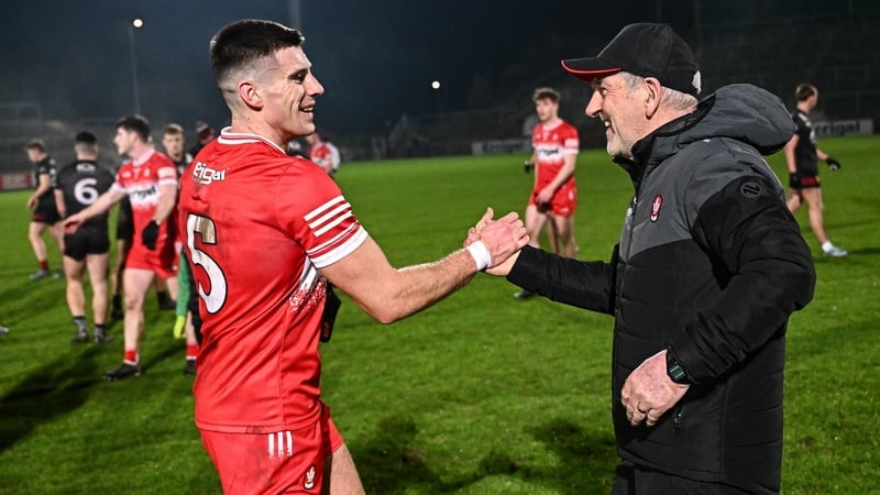 Derry manager Mickey Harte celebrates with Conor Doherty after the win against Down