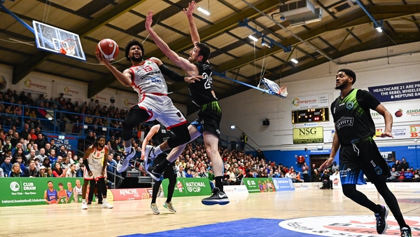 Shawndale Jones Jr of Ballincollig in action against Eoin Quigley of Tralee Warriors