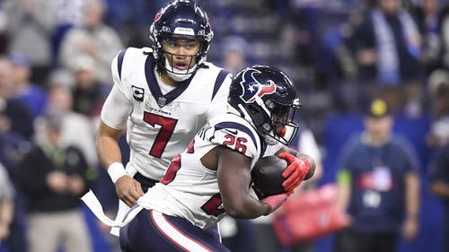 Houston Texans quarterback CJ Stroud (7) hands off to running back Devin Singletary
