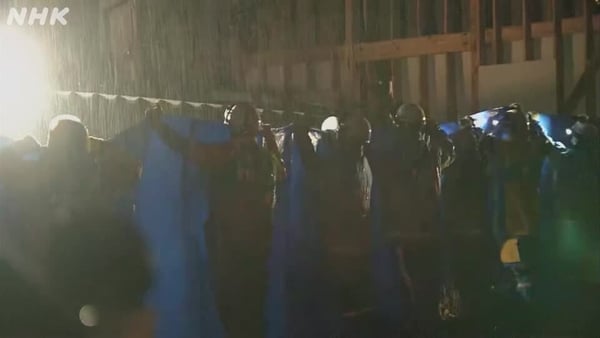 The woman in her 90s was rescued after being trapped under rubble for five days