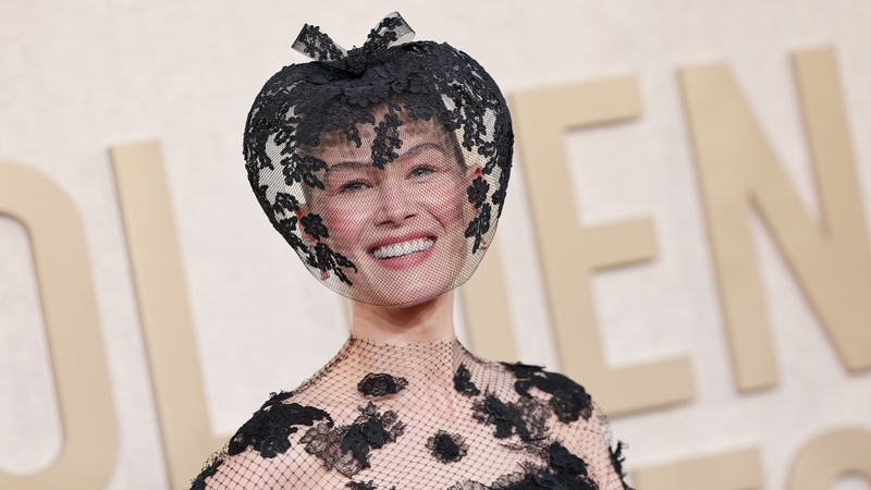 Rosamund Pike wore a headpiece that veiled her face at The Golden Globes 2024