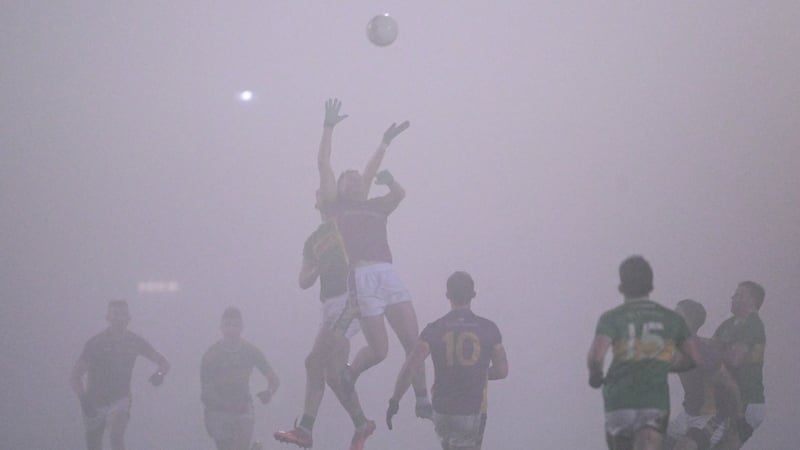 Glen and Kilmacud Crokes players compete for the ball in Newry