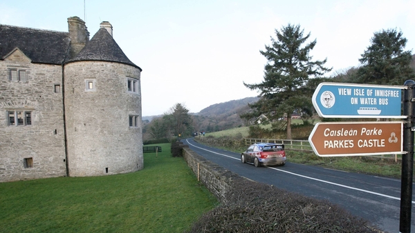 Mikko Hirvonen, driving a Ford Focus WRC, passes Parkes Castle during Stage 17 through Lough Gill, County Leitrim during Rally Ireland in 2009
