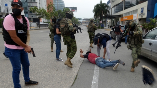 Ecuadorian police arrest several armed men who broke who stormed a live broadcast on the TC television station