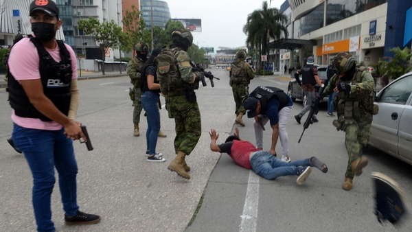 Ecuadorian police arrest several armed men who broke who stormed a live broadcast on the TC television station