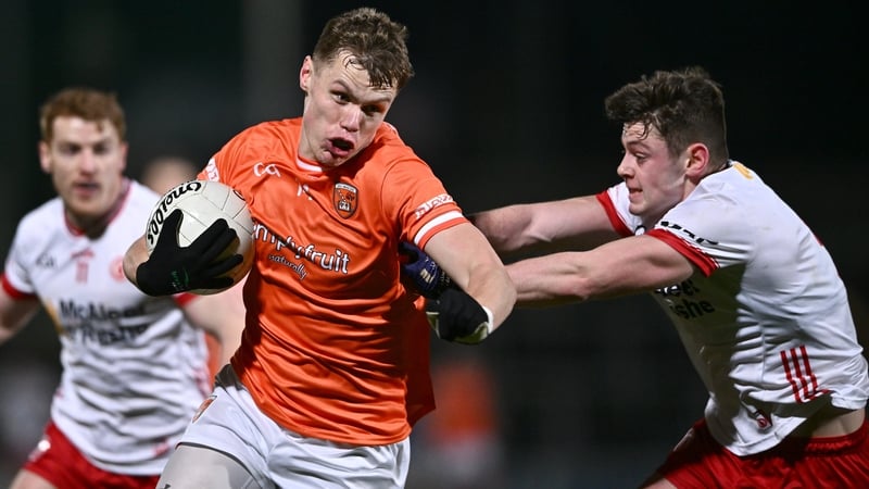 Oisin O'Neill is tackled by Ben Cullen in tonight's McKenna Cup clash