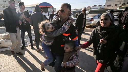 Children injured in an Israeli airstrike are taken to the Al Asqa Hospital in Gaza