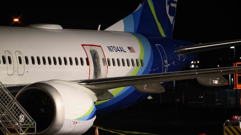 A plastic sheet covers part of an Alaska Airlines Boeing 737 MAX 9 plane at Portland International Airport following an incident onboard. Photo: Getty Images