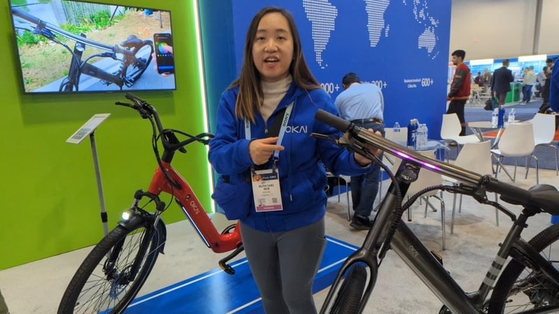 Jia Ren shows off Okai's latest electric bicycle models at CES 2024 in Las Vegas
