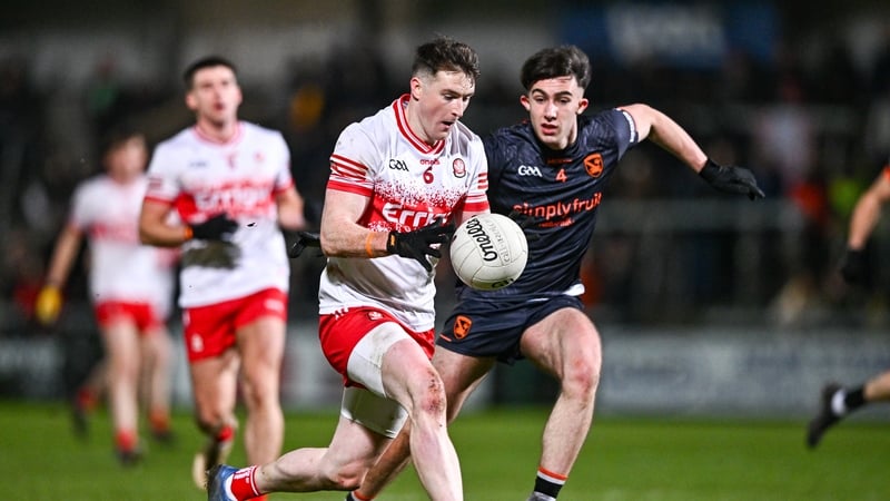 Derry's Gareth McKinless breaks away from Armagh's Sean Conlon