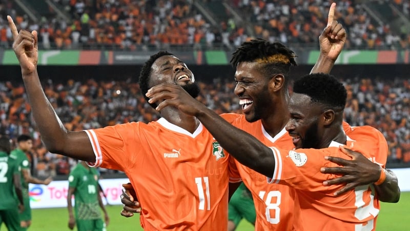 L-R: Jean-Philippe Krasso, Ibrahim Sangare and Jonathan Bamba celebrate Ivory Coast's second goal
