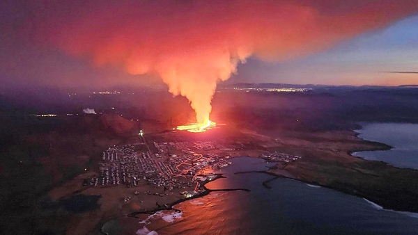 Billowing smoke and flowing lava are seen in this image from the Icelandic Department of Civil Protection and Emergency Management