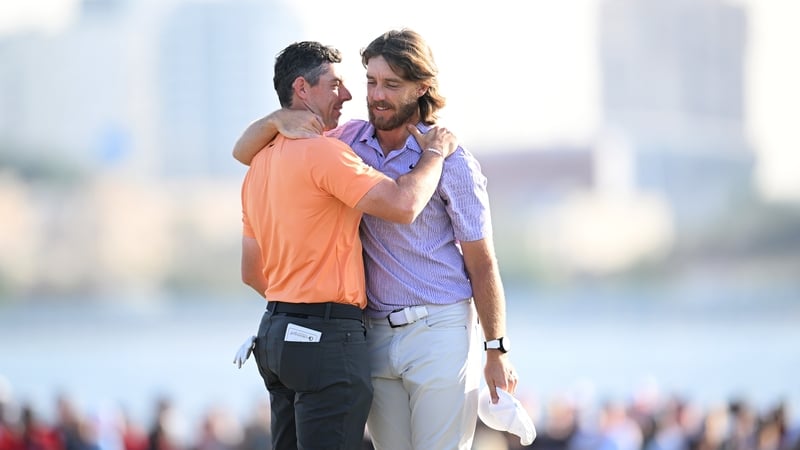 Rory McIlroy and Tommy Fleetwood embrace after a dramatic conclusion to the Dubai Invitational