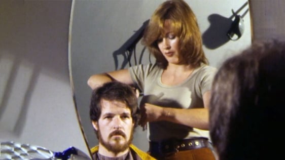 Dublin hairdresser Jackie Farrell gives 'Youngline' reporter Conor McAnally a haircut, 1979