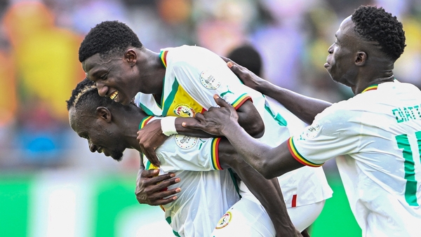 Lamine Camara (C) celebrates with Sadio Mane