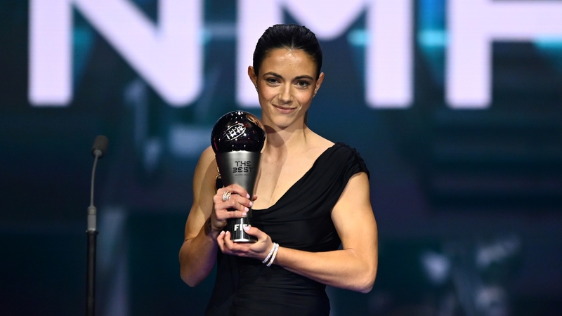 Aitana Bonmati is seen with her trophy on stage