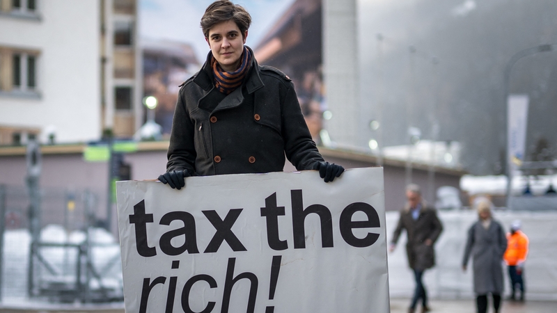 Austrian Marlene Engelhorn, who inherited from her family who owns the Germany's chemical giant BASF, protesting at Davos