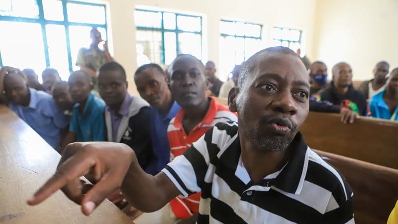 Paul Nthenge Mackenzie (R) is pictured during court proceedings in Mombasa