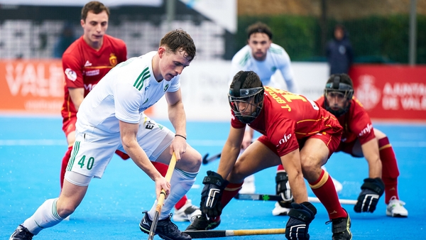 Ben Johnson of Ireland (L) in action against Spain