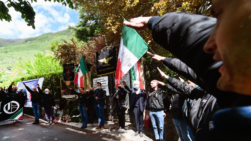 Some people make the fascist salute during a commemoration ceremony for Italian dictator Benito Mussolini in 2021
