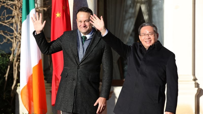 Leo Varadkar and Li Qiang wave at the start of a meeting at Farmleigh House in Phoenix Park in Dublin