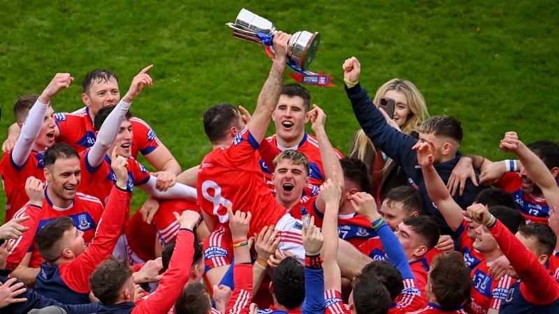 Damien Finnerty is hoisted aloft St Thomas' teammates