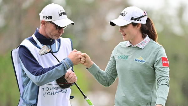 Leona Maguire with her caddie on the 18th green during Thursday's opening round