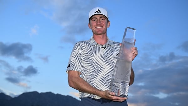 Nick Dunlap with the trophy but not the winner's cheque, due to his amateur status