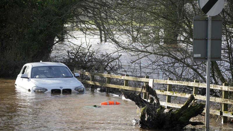 A car is submerged in water after the River Eden burst its banks near Carlisle in England