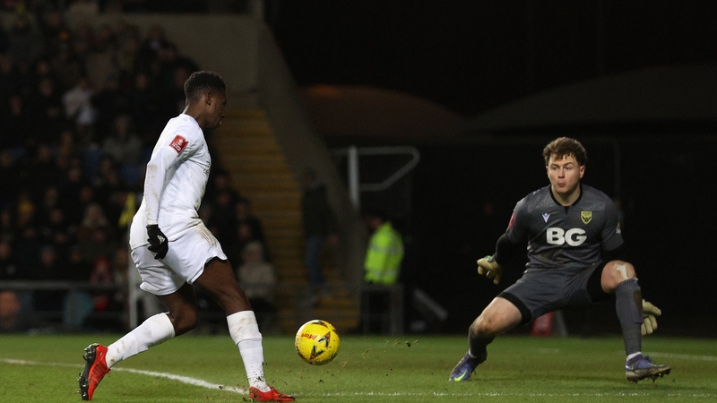 Ed McGinty in action against Arsenal last year as Eddie Nketiah shoots towards goal
