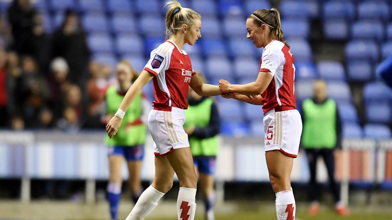 Arsenal's Leah Williamson is given the captain's armband by team-mate Katie McCabe