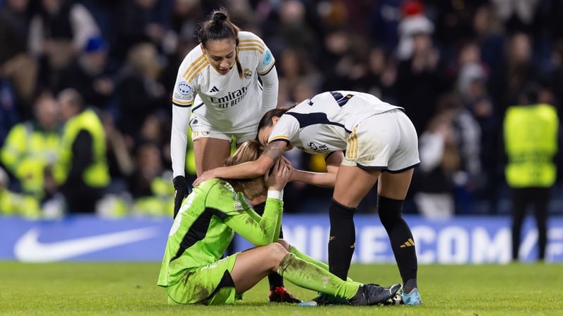 Claudia Zornoza Sanchez and Kathellen Sousa console Real Madrid team-mate and goalkeeper Maylene Chavas after the defeat to Chelsea