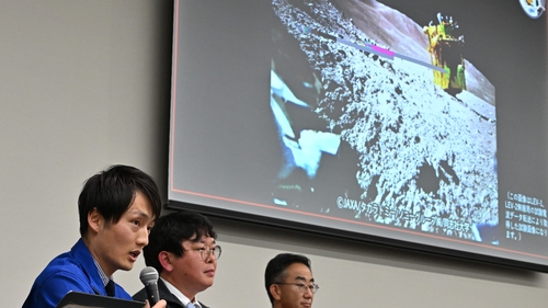 Researcher at JAXA's Space Exploration Innovation Hub Center, explain an image of the lunar surface taken by the smart lander