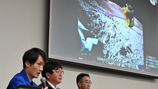 Researcher at JAXA's Space Exploration Innovation Hub Center, explain an image of the lunar surface taken by the smart lander