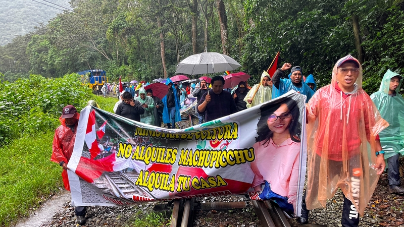 Tour operators and residents demonstrate on the rail tracks near Machu Picchu against the opening of online ticket sales