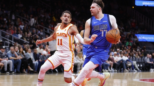 Luka Doncic drives past the Hawks' Trae Young